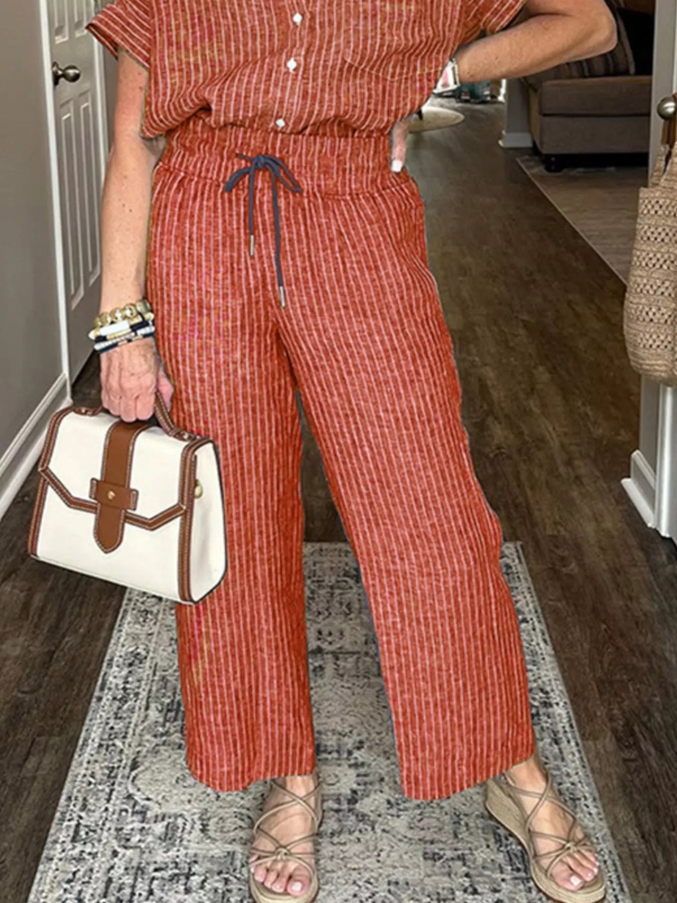 Wide leg pants with adjustable drawstring waist detail.