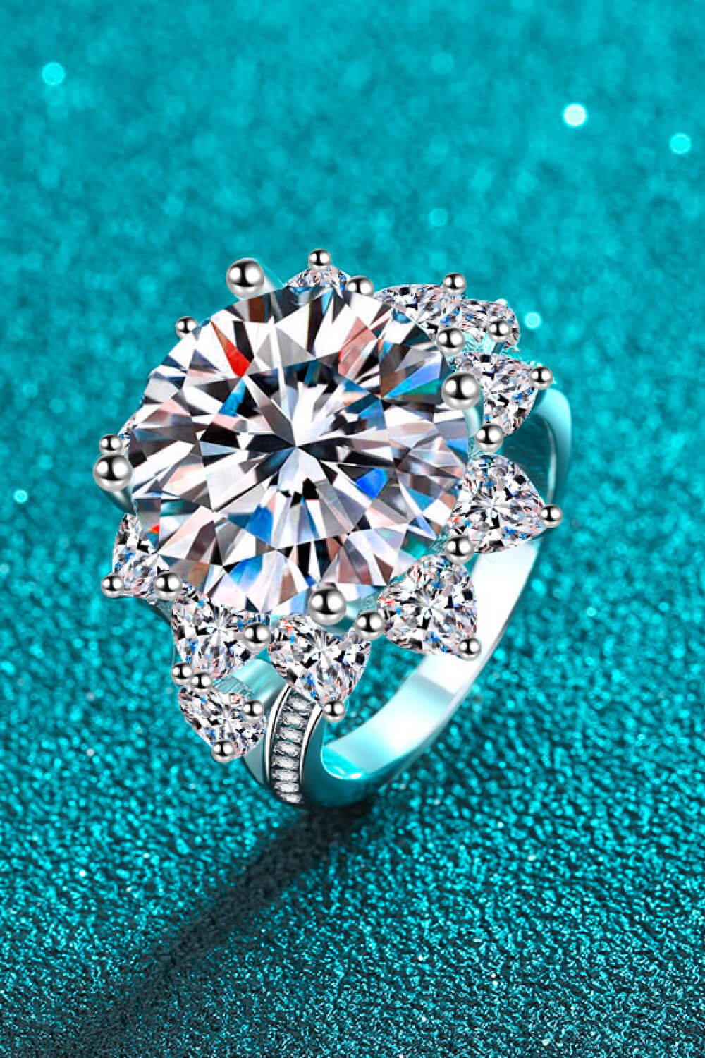 Side detail view of floral moissanite ring showing craftsmanship and setting.