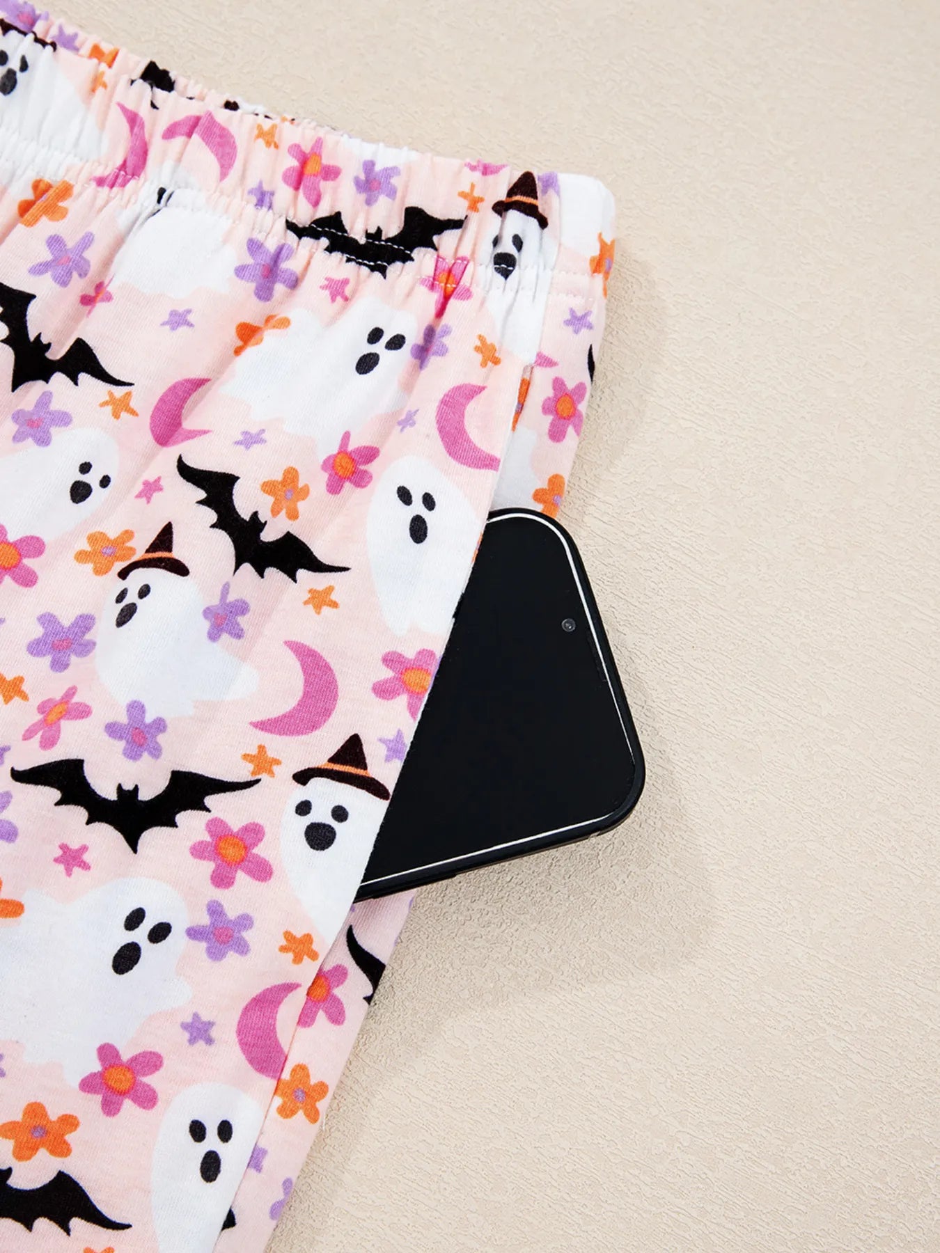 Elastic waistband detail on ghost print lounge pants