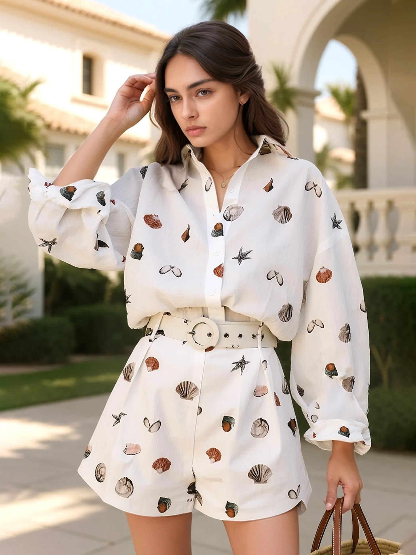 Printed button-up shirt and shorts matching set, front view.