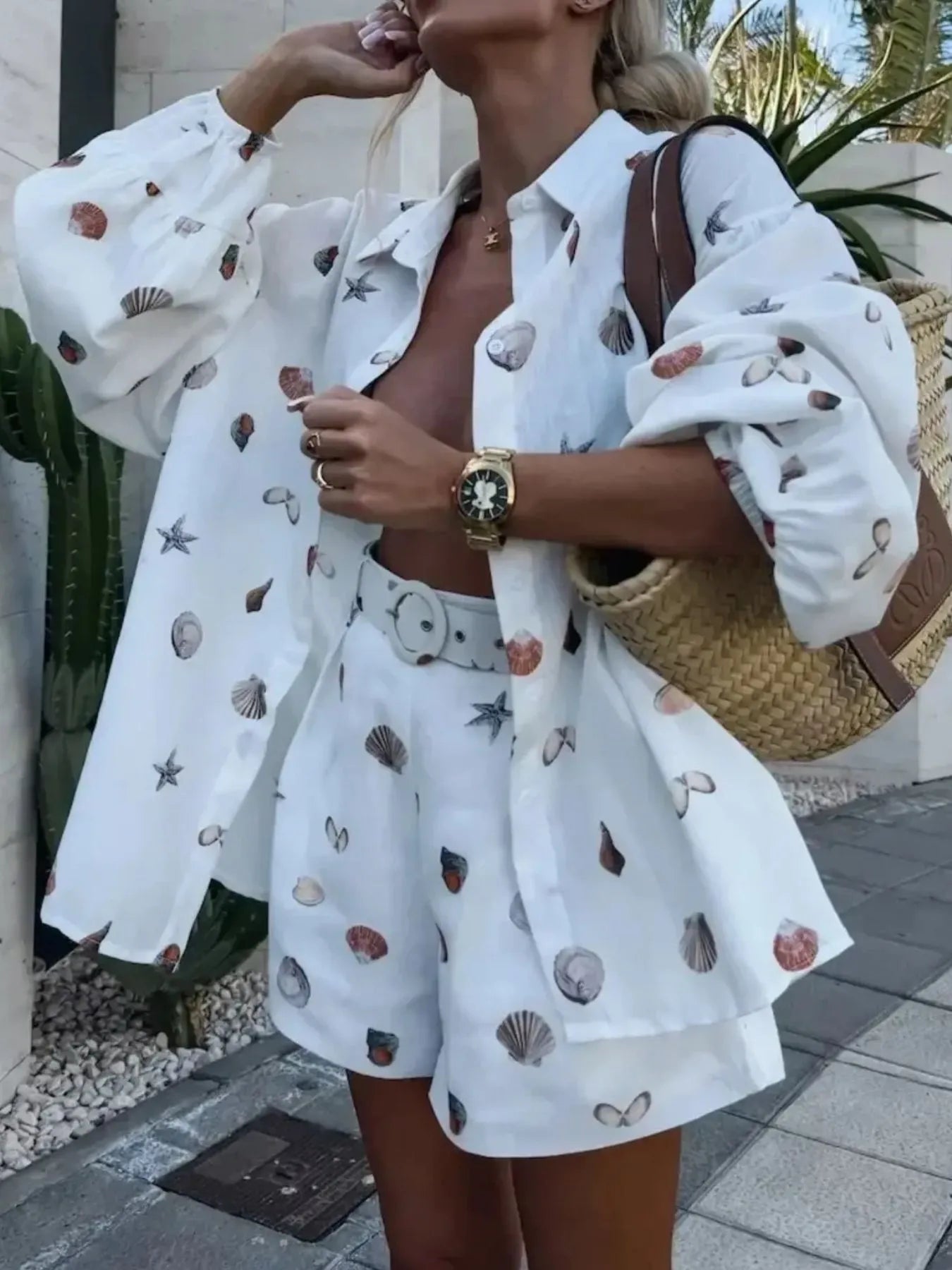 Side view showing the complete printed shirt and shorts outfit.