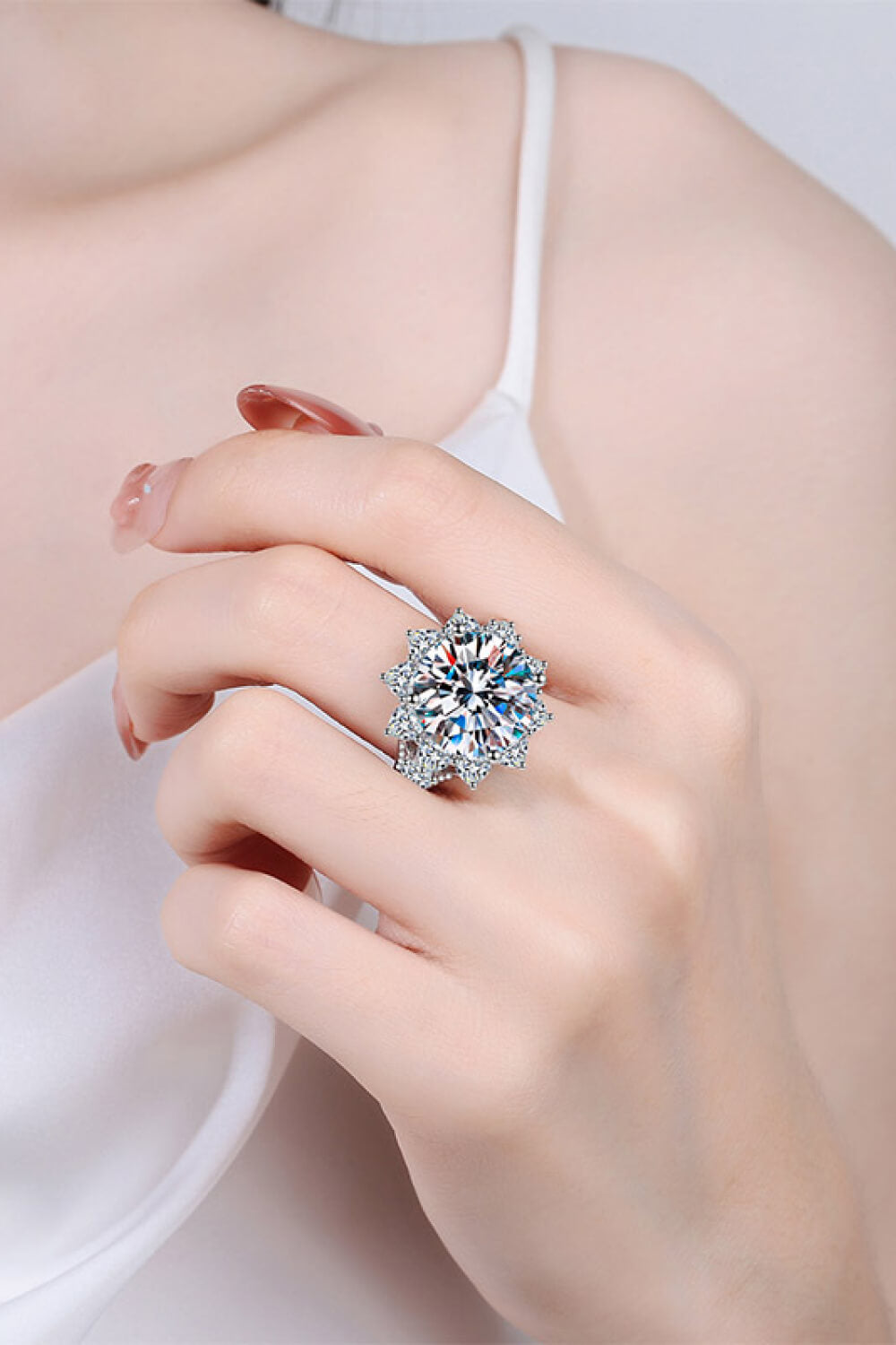 10 10-carat moissanite flower ring being worn, showing scale and luxury appearance.
