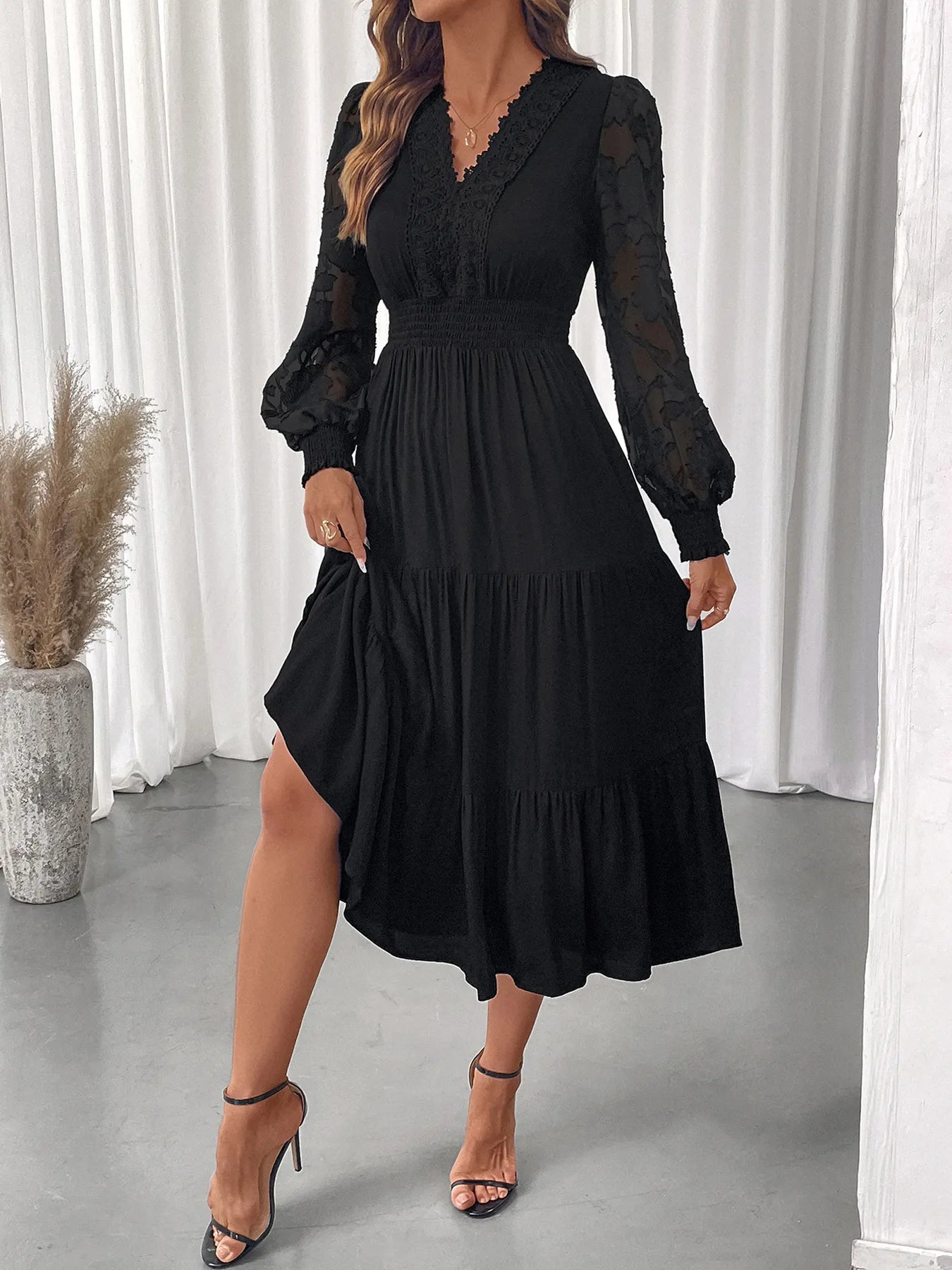 Front view of lace detail lantern sleeve tiered dress
