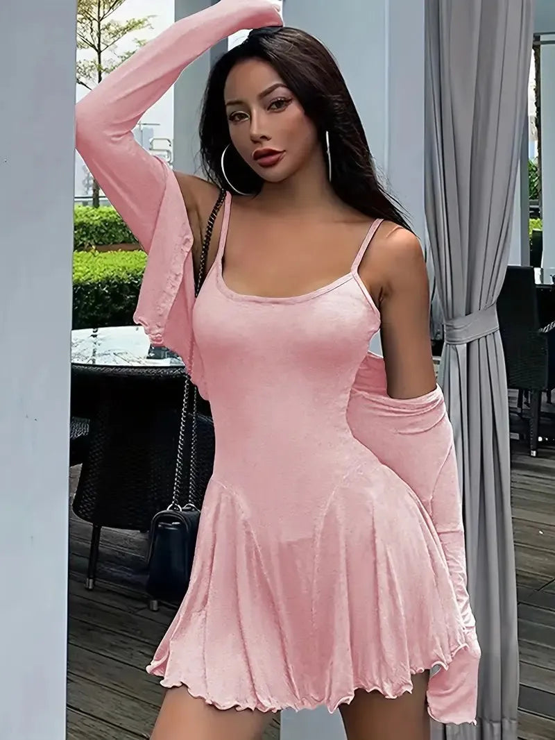 Side profile of pink ribbed crop top and cami dress showing ruffle hem