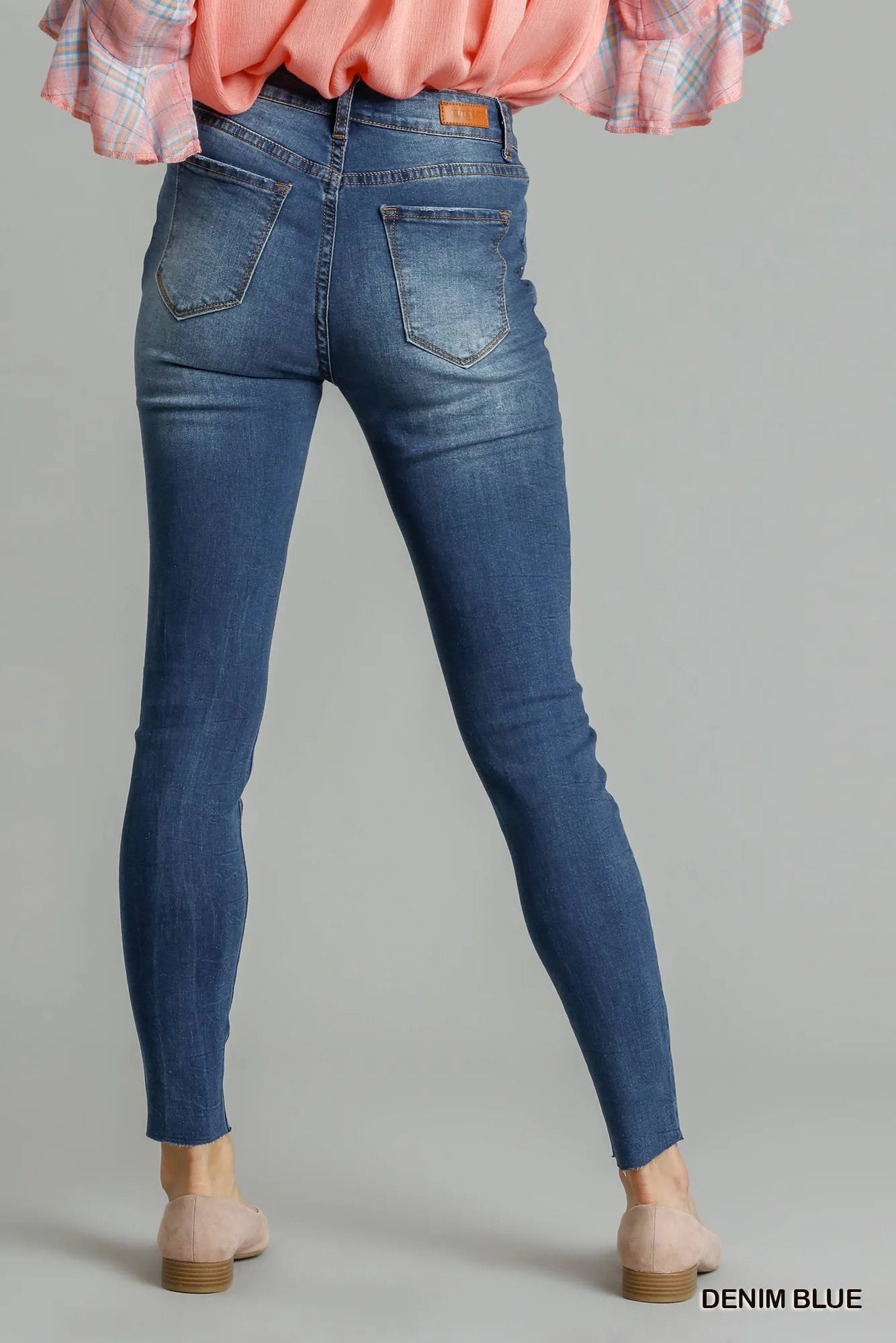 Back view of high-rise skinny jeans with knee rips – Imperio by Johana